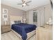 Serene bedroom with a queen bed, nightstands, lamps, and matching dresser at 1403 Rolling Fairway Dr, Davenport, FL 33896