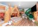 Unique bedroom featuring a custom-built tiki-themed bed with a slide for added fun at 1403 Rolling Fairway Dr, Davenport, FL 33896