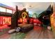 Themed bedroom with a tiki hut bed, bunk beds, and a slide for a fun, immersive experience at 1403 Rolling Fairway Dr, Davenport, FL 33896
