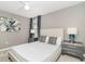 Bedroom with a queen bed, ceiling fan, two side tables with lamps, and carpet flooring at 1403 Rolling Fairway Dr, Davenport, FL 33896