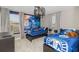 Bedroom with two twin beds and a Star Wars theme, ceiling fan, and carpet flooring at 1403 Rolling Fairway Dr, Davenport, FL 33896