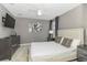 Bedroom featuring a TV on the wall, queen bed, and carpet flooring at 1403 Rolling Fairway Dr, Davenport, FL 33896
