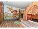 Imaginative bedroom with tiki-themed decorations and a custom tiki hut bed frame at 1403 Rolling Fairway Dr, Davenport, FL 33896