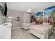 Charming ' bedroom featuring twin beds with princess carriage headboards and a colorful Disney themed mural at 1403 Rolling Fairway Dr, Davenport, FL 33896