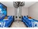 Bedroom with two twin beds and a Star Wars theme, ceiling fan, and carpet flooring at 1403 Rolling Fairway Dr, Davenport, FL 33896