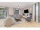 Spacious living room featuring modern furniture, tile floors, and sliding glass doors leading to an outdoor area at 1403 Rolling Fairway Dr, Davenport, FL 33896