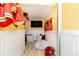 Playroom decorated with a fun fire station theme, complete with costumes and accessories at 1403 Rolling Fairway Dr, Davenport, FL 33896
