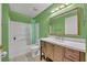 Bathroom features a shower-tub combo, modern vanity with drawers, and ample counter space at 141 Reserve Cir # 113, Oviedo, FL 32765