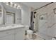 Modern bathroom with sleek vanity, stylish lighting, and a walk-in shower with designer tile at 141 Reserve Cir # 113, Oviedo, FL 32765