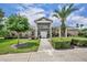 Well-maintained home with a landscaped front yard, mature trees, and a welcoming walkway at 141 Reserve Cir # 113, Oviedo, FL 32765