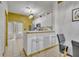 Charming kitchen with a bar, stainless steel appliances, and ample storage with bright accents at 141 Reserve Cir # 113, Oviedo, FL 32765
