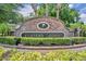 Community entrance sign for Hunter's Reserve with lush landscaping and brick surround at 141 Reserve Cir # 113, Oviedo, FL 32765