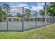 Fenced tennis court in a community, promoting active lifestyles amidst well-maintained residences at 141 Reserve Cir # 113, Oviedo, FL 32765