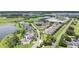 An elevated view of the community showcases a mix of homes, mature trees and tranquil lake views at 15241 Sunrise Grove Ct, Winter Garden, FL 34787