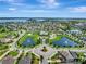 Stunning aerial view of a Primary-planned community with ponds, mature trees, and waterfront homes at 15241 Sunrise Grove Ct, Winter Garden, FL 34787