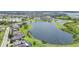 Panoramic aerial view of the community showcasing serene lake views and lush landscaping at 15241 Sunrise Grove Ct, Winter Garden, FL 34787