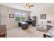 Bedroom featuring an office setup with a desk and chair near a window at 15241 Sunrise Grove Ct, Winter Garden, FL 34787