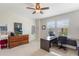 Comfortable bedroom featuring a ceiling fan, modern decor, and bright windows for natural light at 15241 Sunrise Grove Ct, Winter Garden, FL 34787