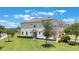 Attractive home with a well-kept lawn, beautiful landscaping, and a charming street presence at 15241 Sunrise Grove Ct, Winter Garden, FL 34787