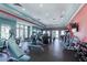 Well-equipped gym featuring cardio machines, weightlifting equipment, and ample workout space at 15241 Sunrise Grove Ct, Winter Garden, FL 34787