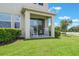 Cozy back patio with rocking chairs, perfect for relaxing and enjoying the outdoors at 15241 Sunrise Grove Ct, Winter Garden, FL 34787