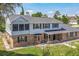 Two-story home featuring brick and siding exterior, a gray roof, dark shutters, and a well-maintained lawn at 1601 Randolph St, Deltona, FL 32725