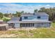 Aerial view of a charming home with a spacious backyard and trees at 1601 Randolph St, Deltona, FL 32725