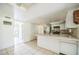 Efficient kitchen featuring tiled floors, a breakfast bar, and necessary appliances at 1601 Randolph St, Deltona, FL 32725