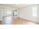 Bright room featuring wood-look floors and decorative wall art at 1601 Randolph St, Deltona, FL 32725