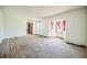 Living room showcasing multiple windows, wood floors and neutral walls at 1601 Randolph St, Deltona, FL 32725