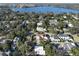 Picturesque aerial view of a neighborhood with mature trees and lake views at 1840 Laurel Rd, Winter Park, FL 32789