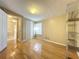 Bright bedroom with wood floors, closet, and natural light at 1840 Laurel Rd, Winter Park, FL 32789