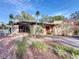 Charming single-story home featuring a uniquely landscaped front yard and a cozy front patio at 1840 Laurel Rd, Winter Park, FL 32789