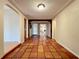 Hallway with tile floors leading to the main living area and secondary rooms at 1840 Laurel Rd, Winter Park, FL 32789