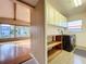 Bright laundry room with washer, dryer, and ample storage space at 1840 Laurel Rd, Winter Park, FL 32789