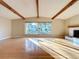 Bright and open living room featuring hardwood floors, vaulted ceilings, and large windows at 1840 Laurel Rd, Winter Park, FL 32789