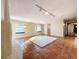 Bright living area with terracotta tile, a white fireplace, and ample natural light from windows at 1840 Laurel Rd, Winter Park, FL 32789