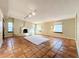 Spacious living room with tile floors, a fireplace, and large windows providing ample natural light at 1840 Laurel Rd, Winter Park, FL 32789