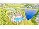 Aerial view of community pool and recreational area with tennis courts and playground at 1933 Darlin Cir, Orlando, FL 32820