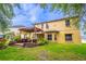 Inviting backyard featuring a pergola-covered seating area and well-maintained lawn at 1933 Darlin Cir, Orlando, FL 32820