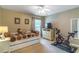 Cozy bedroom with a daybed, a TV sitting atop a dresser, neutral walls, and a ceiling fan at 1933 Darlin Cir, Orlando, FL 32820