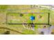 Aerial view of a fully fenced dog park for pets to roam and play at 1933 Darlin Cir, Orlando, FL 32820