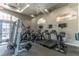 Bright gym with treadmills, stationary bikes, and weight machines for a complete workout at 1933 Darlin Cir, Orlando, FL 32820