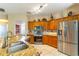 Gourmet kitchen featuring stainless steel appliances, granite countertops, and ample storage space at 1933 Darlin Cir, Orlando, FL 32820