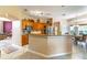 Well-equipped kitchen featuring wooden cabinetry, granite countertops, and stainless steel appliances at 1933 Darlin Cir, Orlando, FL 32820