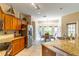 Bright kitchen with granite countertops, stainless steel appliances, and tiled floor adjacent to breakfast nook at 1933 Darlin Cir, Orlando, FL 32820