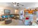 Spacious living room featuring comfortable seating, arched entry, and open to kitchen area at 1933 Darlin Cir, Orlando, FL 32820