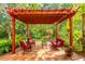 Inviting outdoor patio under pergola featuring comfortable seating, perfect for entertaining or relaxing at 1933 Darlin Cir, Orlando, FL 32820