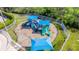 Well-maintained fenced playground with slides and play structures, perfect for families at 1933 Darlin Cir, Orlando, FL 32820