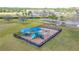 Aerial view of a fenced playground with swings and slides at 1933 Darlin Cir, Orlando, FL 32820